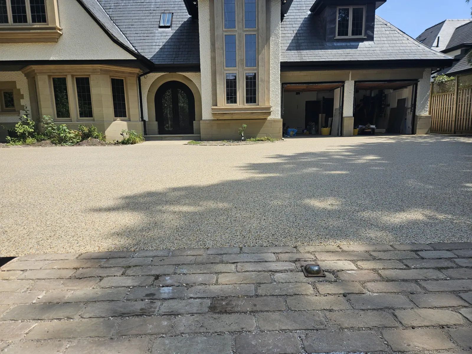 Aurora blend resin bound driveway, permeable and hand-trowelled, at a home in Hale Barns, Cheshire